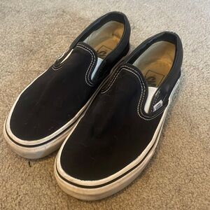 Vans black slip ons